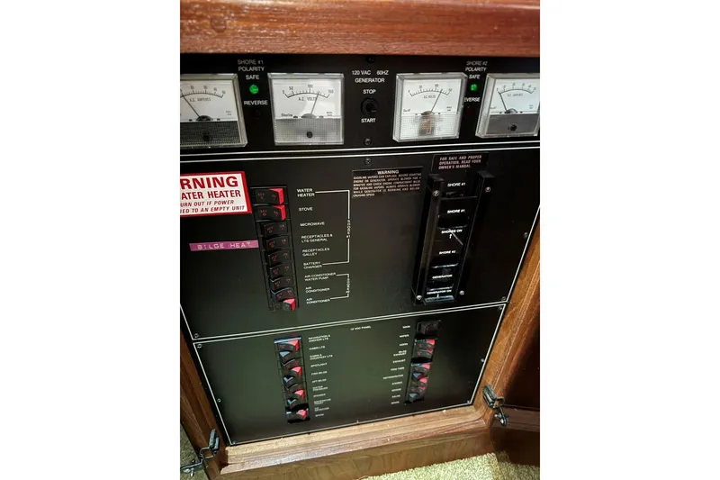 Slide: The Image of Electrical control panel of a 1993 Carver 300 Aft Cabin boat. - 45