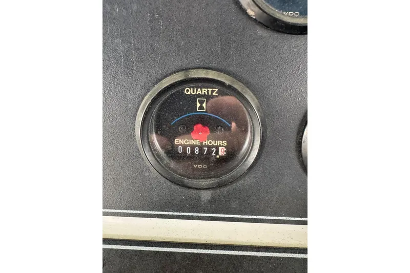 Slide: The Image of 1993 Carver 300 Aft Cabin engine hour meter displaying 872 hours. - 46