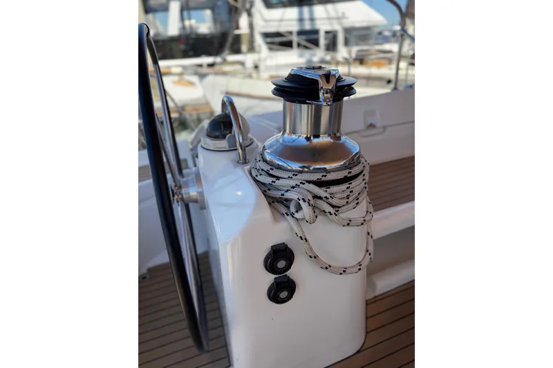 Slide: The Image of Steering wheel and winch on 2006 Beneteau Oceanis 523 sailboat deck. - 10
