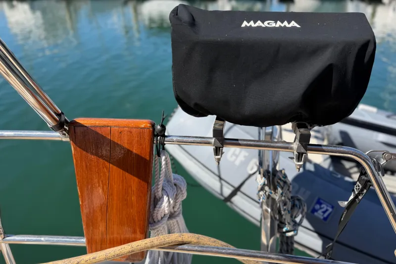 Slide: The Image of Beneteau Oceanis 523 yacht detail with Magma grill cover, docked in marina, 2006 model. - 14