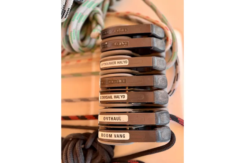Slide: The Image of Close-up of labeled rope clutches on a 2006 Beneteau Oceanis 523 sailboat. - 17