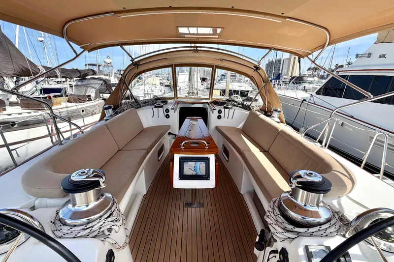 Slide: The Image of Luxurious 2006 Beneteau Oceanis 523 yacht cockpit with beige seating and navigation equipment. - 27