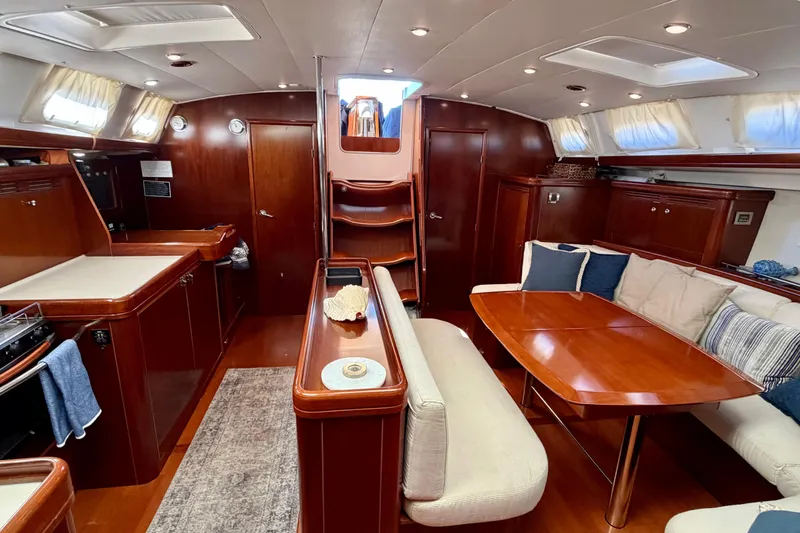 Slide: The Image of Luxurious interior of 2006 Beneteau Oceanis 523 yacht with elegant wood finish and cozy seating. - 28