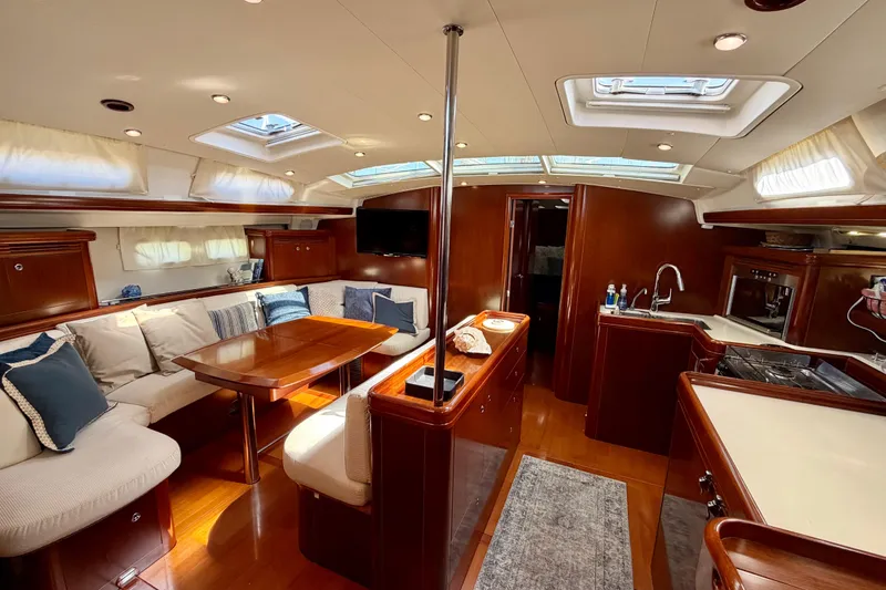 Slide: The Image of Luxurious interior of 2006 Beneteau Oceanis 523 yacht with elegant wood finish and cozy seating. - 29