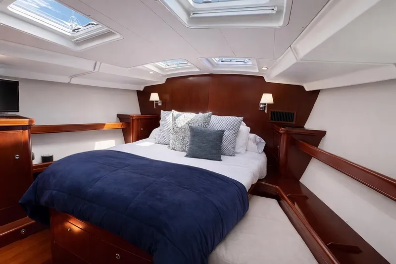 Slide: The Image of Luxurious cabin interior of 2006 Beneteau Oceanis 523 yacht with skylights and elegant bedding. - 3