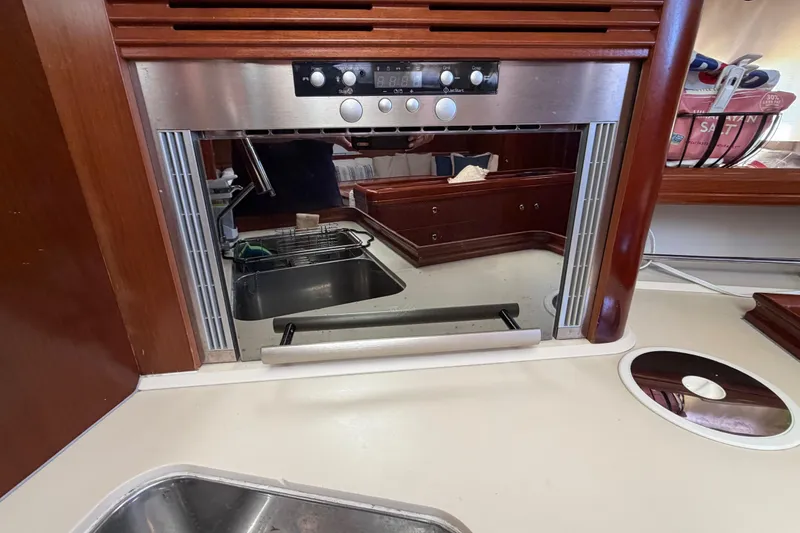 Slide: The Image of Galley kitchen in 2006 Beneteau Oceanis 523 yacht with stainless steel appliances. - 37