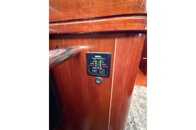 Slide: The Image of Control panel on 2006 Beneteau Oceanis 523 yacht interior, featuring propane gas detector. - 38