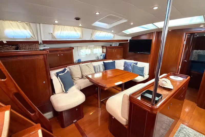 Slide: The Image of Luxurious interior of 2006 Beneteau Oceanis 523 yacht with elegant wood finish and cozy seating. - 39