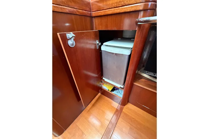 Slide: The Image of Wooden cabinet interior on a 2006 Beneteau Oceanis 523 yacht. - 44