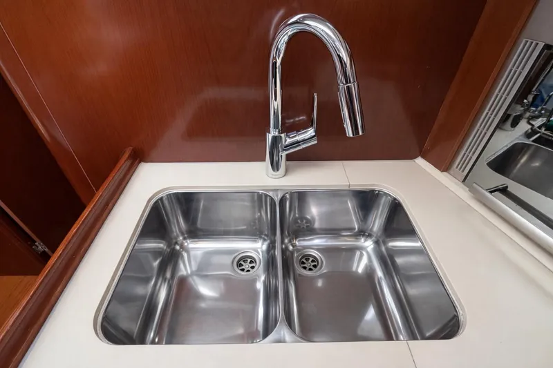 Slide: The Image of Stainless steel double sink with modern faucet on 2006 Beneteau Oceanis 523 yacht. - 45