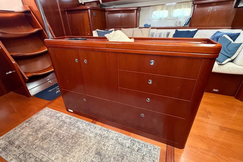 Slide: The Image of Luxurious interior of 2006 Beneteau Oceanis 523 yacht with elegant wood cabinetry and cozy seating. - 46
