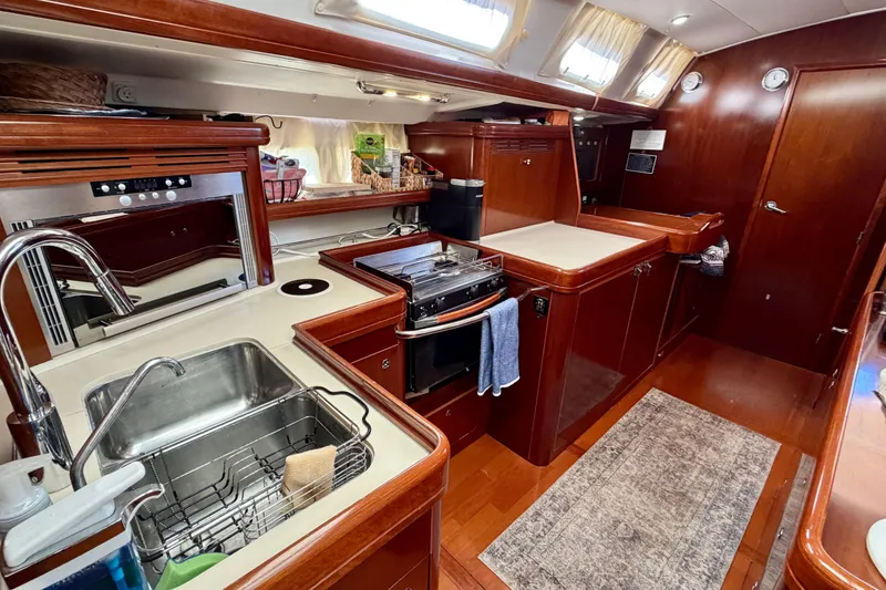 Slide: The Image of Luxurious 2006 Beneteau Oceanis 523 yacht interior with modern kitchen amenities. - 48