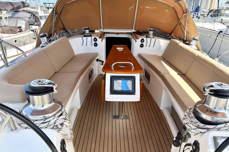 Slide: The Image of Spacious cockpit of 2006 Beneteau Oceanis 523 sailboat with seating and navigation equipment. - 5