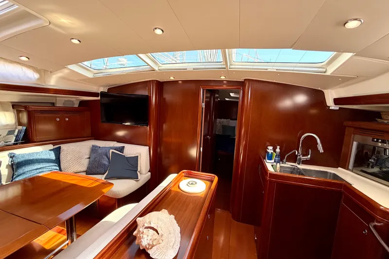 Slide: The Image of Luxurious interior of 2006 Beneteau Oceanis 523 yacht with elegant wood finish. - 50