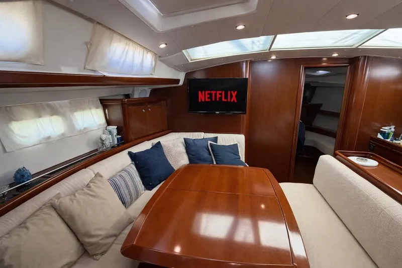 Slide: The Image of Luxurious interior of 2006 Beneteau Oceanis 523 yacht with cozy seating and TV. - 51