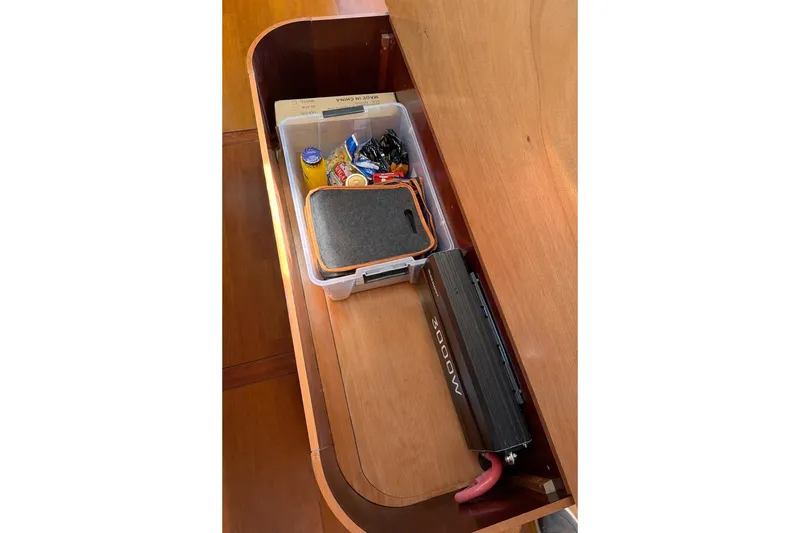 Slide: The Image of Storage compartment in a 2006 Beneteau Oceanis 523 yacht with organized supplies and equipment. - 52