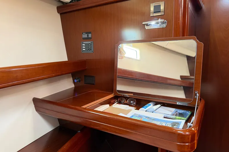 Slide: The Image of Interior of 2006 Beneteau Oceanis 523 yacht with wooden desk and mirror. - 57