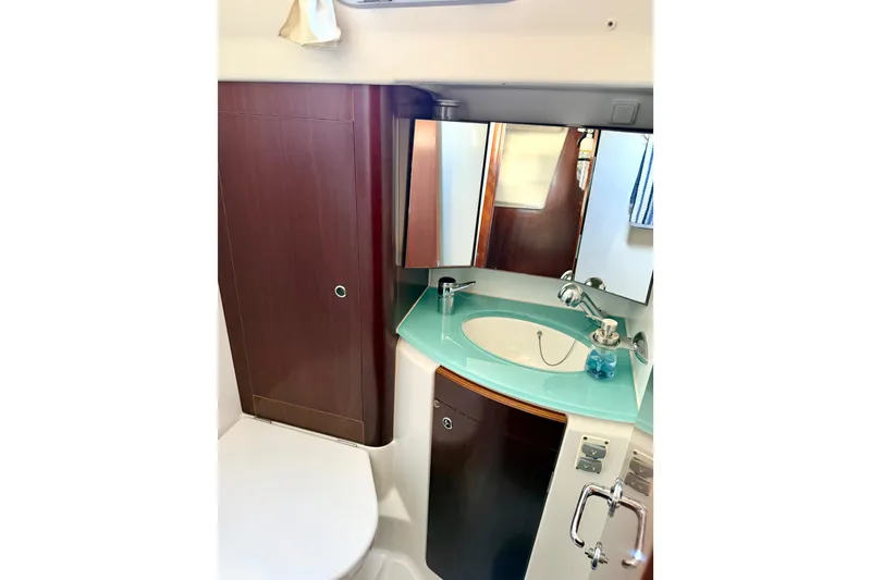 Slide: The Image of Luxurious bathroom in 2006 Beneteau Oceanis 523 yacht with modern fixtures and wood accents. - 61