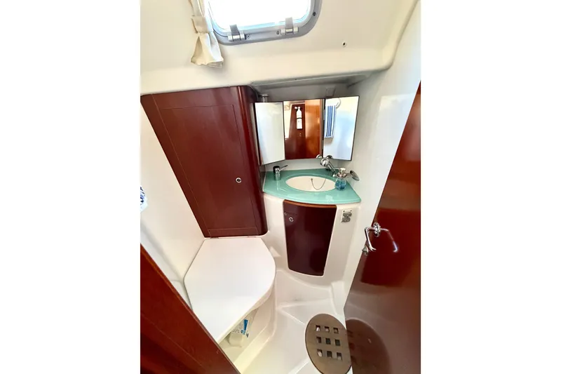 Slide: The Image of Bathroom interior of 2006 Beneteau Oceanis 523 yacht with sink and mirror. - 64