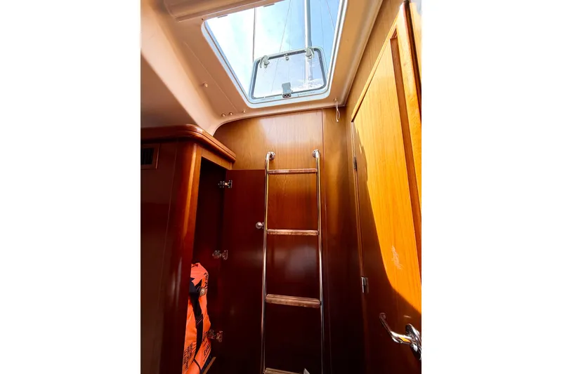 Slide: The Image of Interior view of 2006 Beneteau Oceanis 523 sailboat with wooden ladder and hatch. - 69