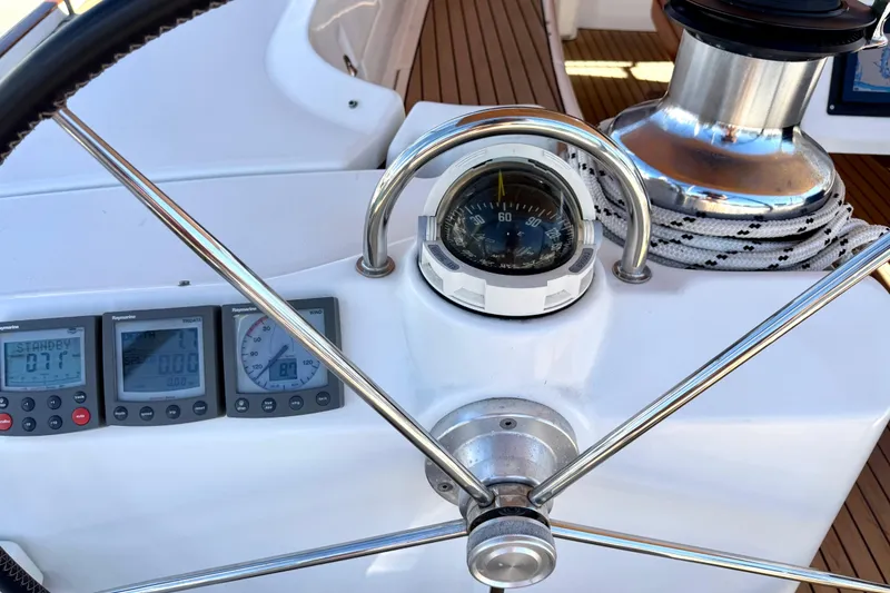 Slide: The Image of Steering wheel and navigation instruments on a 2006 Beneteau Oceanis 523 yacht. - 7