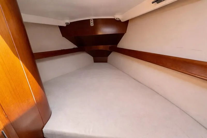 Slide: The Image of Interior cabin of 2006 Beneteau Oceanis 523 yacht, featuring cozy sleeping quarters. - 71