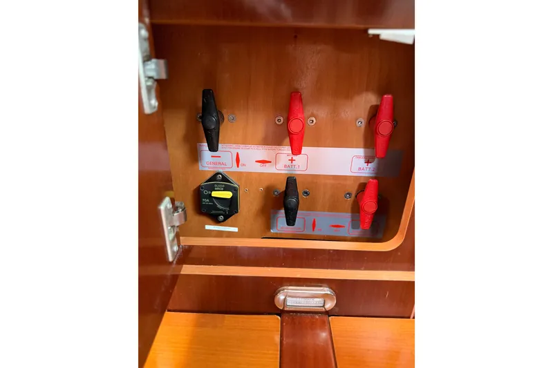 Slide: The Image of Electrical panel of a 2006 Beneteau Oceanis 523 sailboat with switches and labels. - 73
