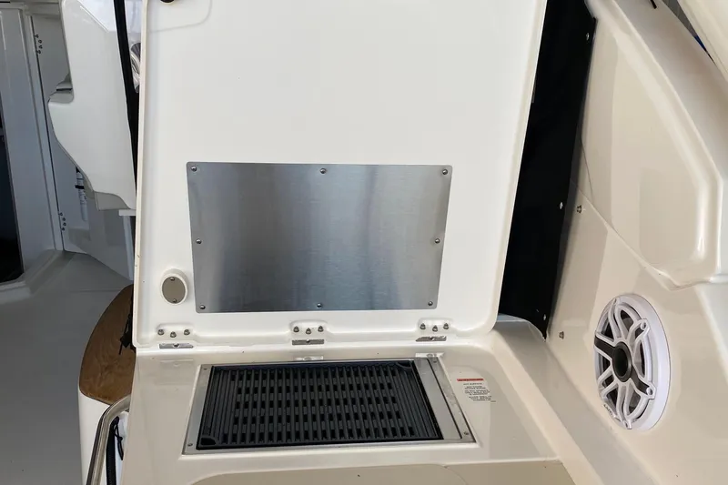 Slide: The Image of 2022 Pursuit DC 365 boat interior with stainless steel panel and speaker. - 4