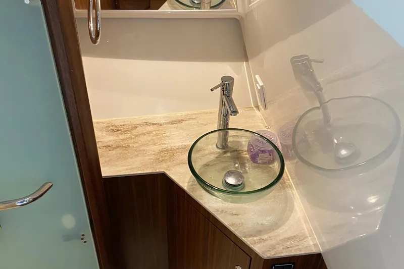 Slide: The Image of Modern bathroom sink in 2022 Pursuit DC 365 boat. - 6