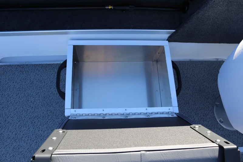 Slide: The Image of Open storage compartment in 2026 Smoker Craft Osprey 162 boat interior. - 15