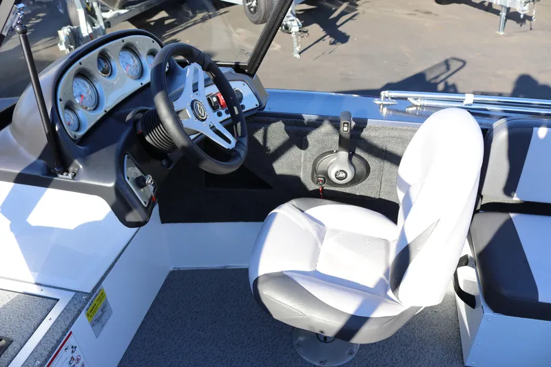 Slide: The Image of 2026 Smoker Craft Osprey 162 boat interior with steering wheel and gauges. - 18
