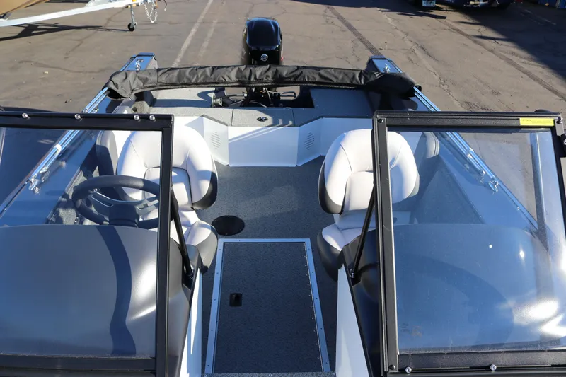 Slide: The Image of 2026 Smoker Craft Osprey 162 boat interior with dual seats and steering wheel. - 19