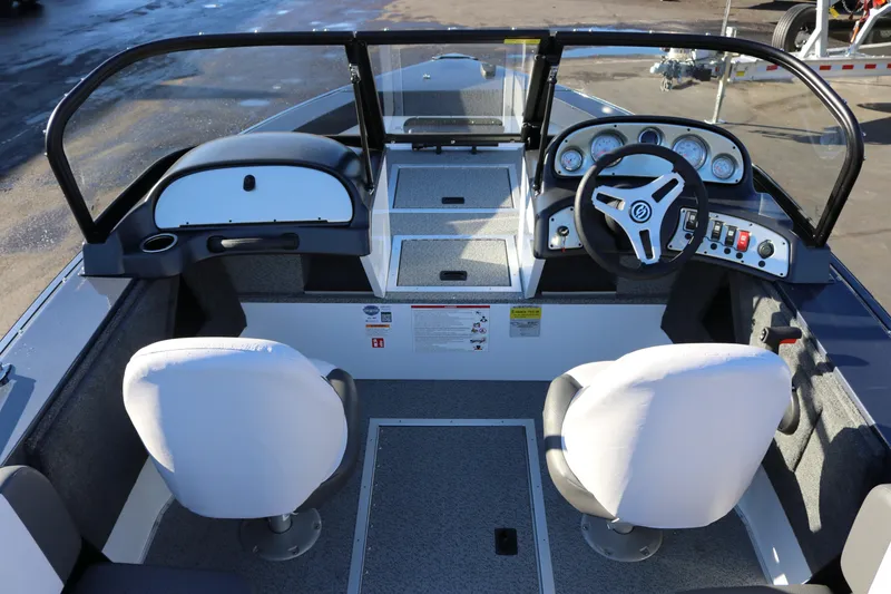 Slide: The Image of 2026 Smoker Craft Osprey 162 boat interior with dual seats and modern dashboard. - 6
