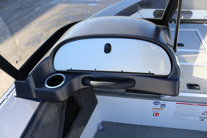 Slide: The Image of 2026 Smoker Craft Osprey 162 boat dashboard with cup holder and storage compartment. - 8