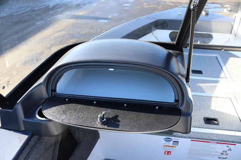 Slide: The Image of 2026 Smoker Craft Osprey 162 boat dashboard with open glove compartment. - 9