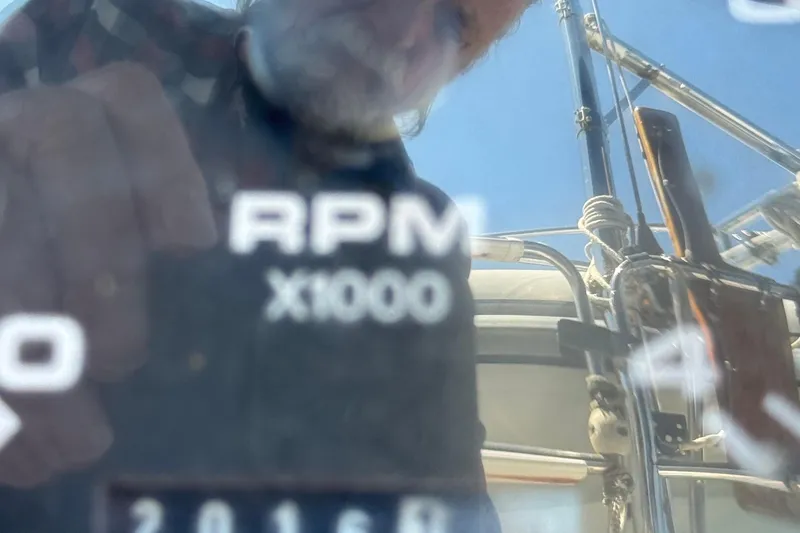 Slide: The Image of Reflection on Catalina 380 sailboat's RPM gauge, showcasing nautical equipment. - 10