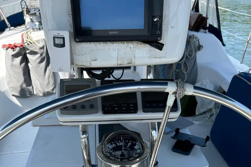 Slide: The Image of Cockpit of 2000 Catalina 380 sailboat with navigation instruments and compass. - 14