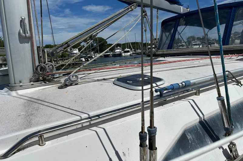Slide: The Image of Deck of 2000 Catalina 380 sailboat with rigging and marina background. - 18