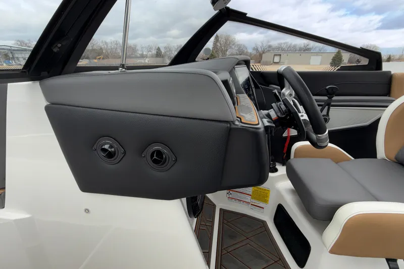Slide: The Image of 2023 Tigé 23ZX boat interior with modern dashboard and steering wheel design. - 17