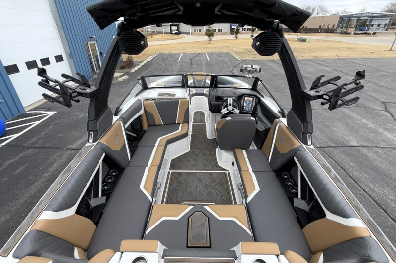 Slide: The Image of 2023 Tigé 23ZX boat interior with luxurious seating and advanced dashboard features. - 21