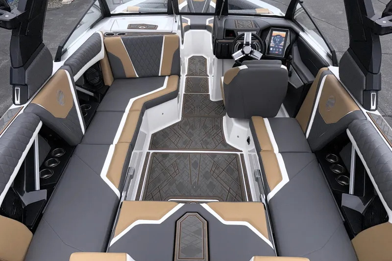 Slide: The Image of 2023 Tigé 23ZX boat interior with luxurious seating and modern dashboard design. - 22
