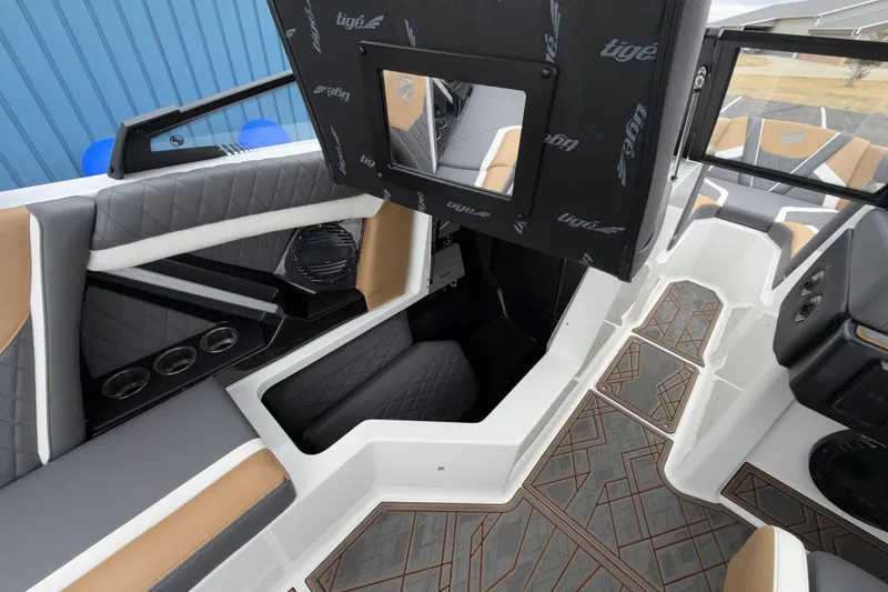 Slide: The Image of 2023 Tigé 23ZX boat interior with modern seating and stylish flooring design. - 23