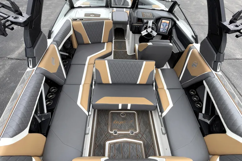 Slide: The Image of 2023 Tigé 23ZX boat interior with luxurious seating and modern dashboard design. - 26
