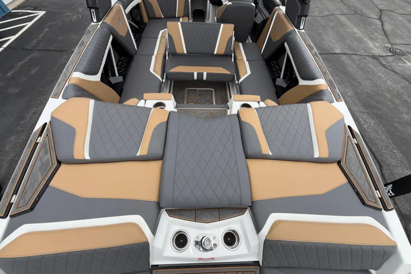 Slide: The Image of 2023 Tigé 23ZX boat interior with luxurious gray and tan seating design. - 27