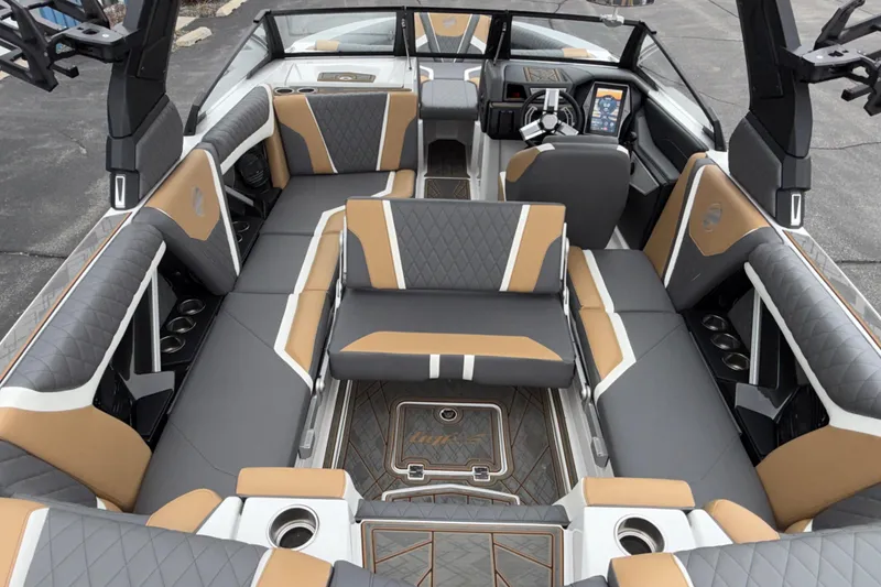Slide: The Image of 2023 Tigé 23ZX boat interior with luxurious seating and modern dashboard design. - 28