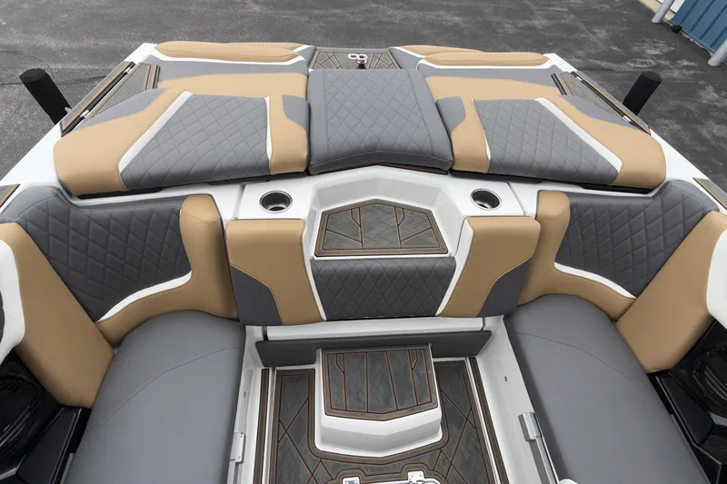 Slide: The Image of 2023 Tigé 23ZX boat interior with luxurious tan and gray seating. - 29