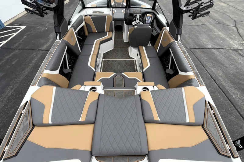 Slide: The Image of 2023 Tigé 23ZX boat interior with luxurious seating and modern dashboard. - 33