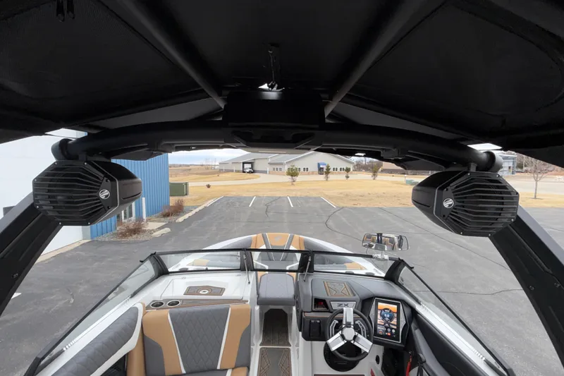 Slide: The Image of 2023 Tigé 23ZX boat interior with advanced dashboard and premium speakers. - 34