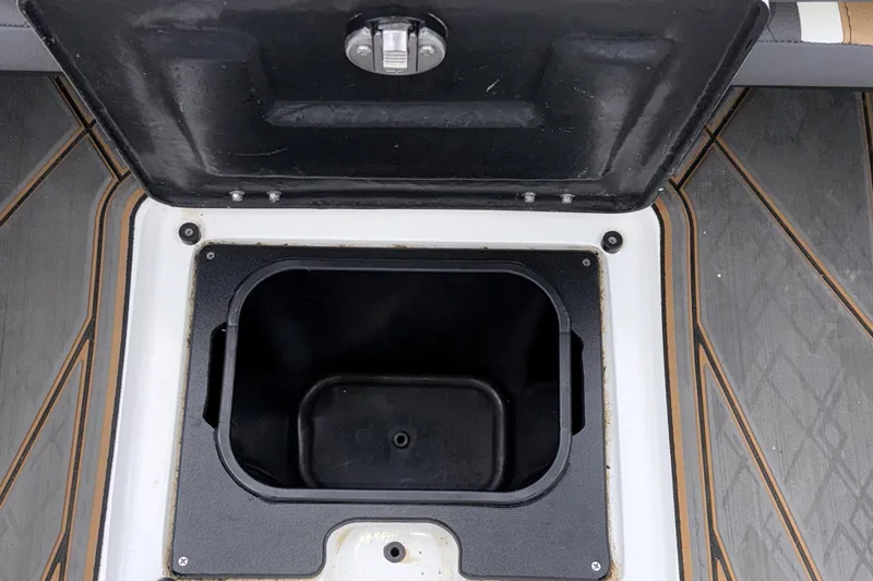 Slide: The Image of Open storage compartment on 2023 Tigé 23ZX boat, featuring durable interior design. - 35