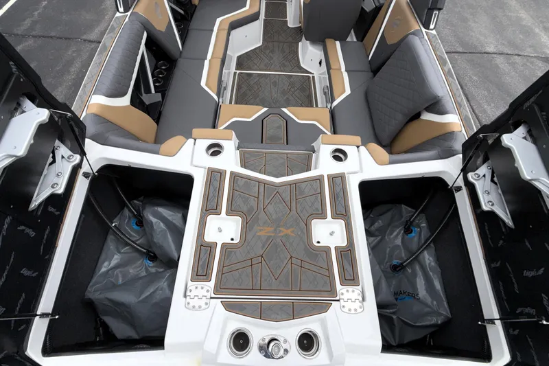 Slide: The Image of 2023 Tigé 23ZX boat interior with stylish seating and storage compartments. - 36
